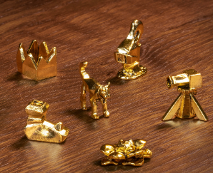 Exclusive RuneScape Monopoly tokens including Bob the Cat, Party Hat, Dragon Boot, and other collectible game pieces.