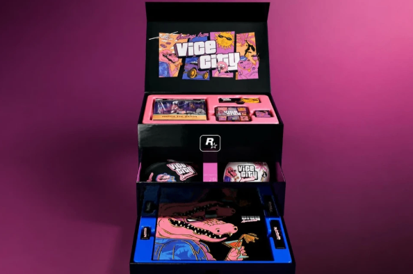 The GTA 6 Vice City Collection includes a Macca the Gator figure, Oakley Frogskins sunglasses, Leonida Keys crossbody bag, New Era hat, magnetic mirror, shot glass, collectible spoon, razor blade keychain, enamel pins, stickers and a Leonida map poster.